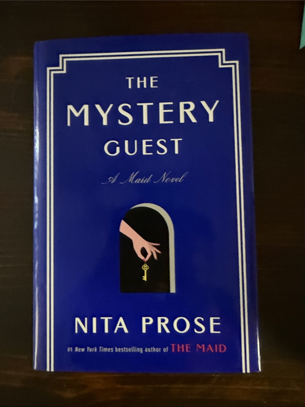 The Mystery Guest by Nita Prose - Blue Hardcover Novel